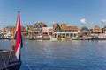 Dutch flag in front of the harbor of Volendam