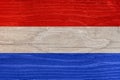 Dutch flag with wood texture. Flag of the Netherlands on a wooden texture Royalty Free Stock Photo