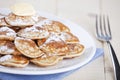 Dutch food: `Poffertjes` or little pancakes Royalty Free Stock Photo
