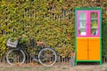 Free mini public library with bicycle in autumn Royalty Free Stock Photo