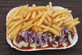 Dutch fries with meat and red onions