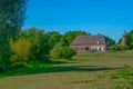 Dutch grass meadow in front of small village Ooij