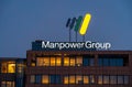 Dutch headquarters of multinational staffing firm ManpowerGroup. Manpower group sign and logo at the top of the building