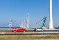 Dutch highway with cars along construction site wind turbines