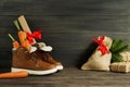 Dutch Holiday Sinterklaas background. Children`s shoes, carrots Royalty Free Stock Photo