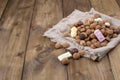Dutch holiday Sinterklaas background , gifts, pepernoten, traditional sweets strooigoed . Flat lay and copy space. wooden
