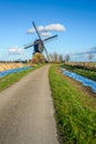 Dutch hollow post mill from 1795 on a sunny day Royalty Free Stock Photo