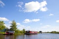 Dutch houseboats on little river in The Netherlands