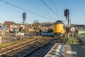 Dutch Intercity train with germand wagons passing the village during wintertime