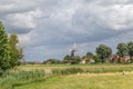 Dutch landscape with windmill and flock of sheep Royalty Free Stock Photo