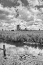 Dutch landscape with windmills in a field and dramatic clouds, The netherlands