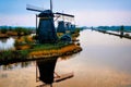 Dutch landscape, windmills at Kinderdijk village, a famous authentic tourism attraction in the Netherlands on sunset.