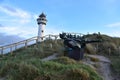 Dutch lighthouse and boat statue in Egmon aan Zee