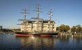 Dutch maritime museum with historic sail ship in front in Amsterdam