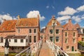 Dutch medieval houses with hanging kitches at the Damsterdiep canal in Appingedam, Groningen, The Netherlands Royalty Free Stock Photo
