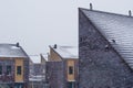 Dutch modern rooftops covered in snow during snowy weather, Neighborhood in the Netherlands, modern architecture background