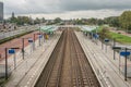 Dutch modern train station with a cloudy sky