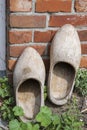 Dutch natural colored clogs at a back door of a house