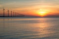 Dutch off shore wind turbines during a sunset Royalty Free Stock Photo