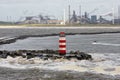 Dutch pier IJmuiden with lighthouse and stormy sea