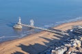 Dutch pier Scheveningen with long shadows Kurhaus at the beach Royalty Free Stock Photo