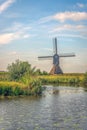 Dutch hollow post mill at the water\'s edge Royalty Free Stock Photo