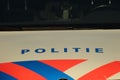 Dutch police car parked on the street in nieuwerkerk aan den Ijssel in the netherlands with text politie which means police in eng