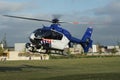 Dutch police helicopter landing in a urban park Royalty Free Stock Photo