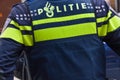 Dutch Policeman From The Back At Amsterdam The Netherlands Royalty Free Stock Photo