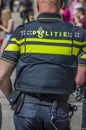 Dutch Policeman From The Back At Amsterdam The Netherlands Royalty Free Stock Photo