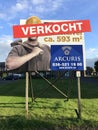 Dutch real estate billboard: sold.