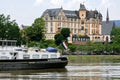 Dutch ship on and historic building at the Moselle