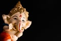 Dutch shot of beautiful ganesha on black background. wisdom concept