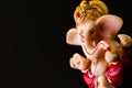 Dutch shot close up of ganesha statue on black background with concept. hinduism and religious concept