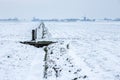 Dutch snowy farmland with windmills. Royalty Free Stock Photo