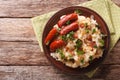 Dutch stamppot of potatoes, cabbage and carrots, with sausages c Royalty Free Stock Photo