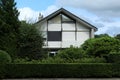 dutch street village architecture house building bushes tree Royalty Free Stock Photo