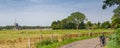 Dutch summer panorama with windmill and bike Royalty Free Stock Photo