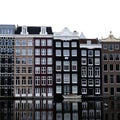 Dutch tall houses on canal in city center of Amsterdam