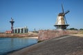 Dutch traditional windmill at dike near city Vlissingen