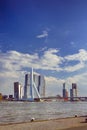 Dutch Travel Concepts. Attractive View of Renowned Erasmusbrug Swan Bridge in Rotterdam in front of Port and Harbour. Picture