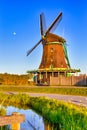 Dutch Travel Concepts. Traditional Dutch Windmill in the Village of Zaanse Schans at Daytime in the Netherlands Royalty Free Stock Photo