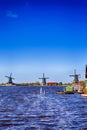 Dutch Travel Concepts. Traditional Dutch Windmills in the Village of Zaanse Schans at Daytime in the Netherlands Royalty Free Stock Photo