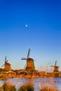 Dutch Travel Concepts. Traditional Dutch Windmills in the Village of Zaanse Schans at Daytime in the Netherlands Royalty Free Stock Photo