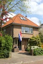 Characteristic Dutch home with the Dutch national flag, Holland