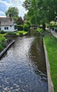 Dutch village with colorful ornamental garden and spring flowers, Giethoorn Royalty Free Stock Photo