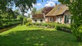 Dutch village with colorful ornamental garden and spring flowers, Giethoorn Royalty Free Stock Photo