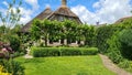 Dutch village with colorful ornamental garden and spring flowers, Giethoorn Royalty Free Stock Photo