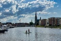 Dutch village and paddle boarder