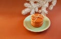 Dutch waffle stroopwafel background cookies round brown pastries plate blue christmas tree white yellow